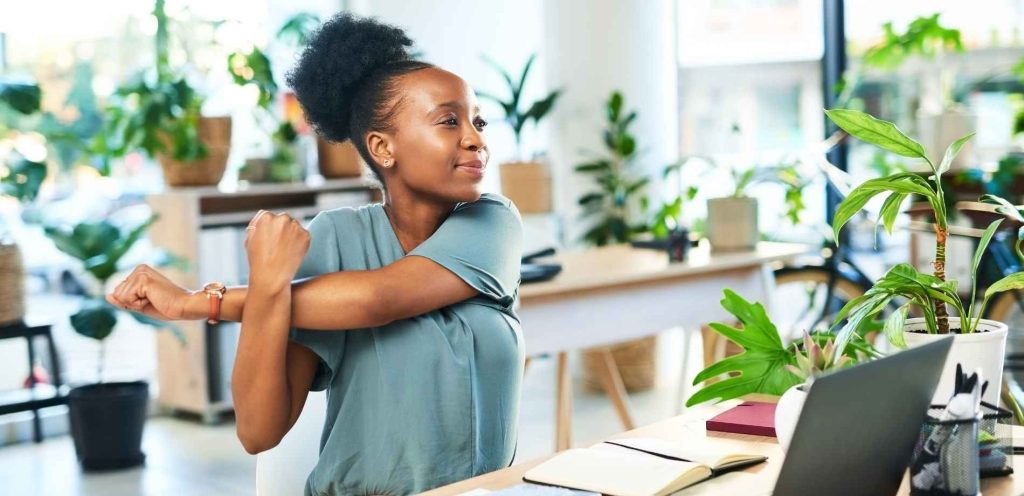 woman stretching at work