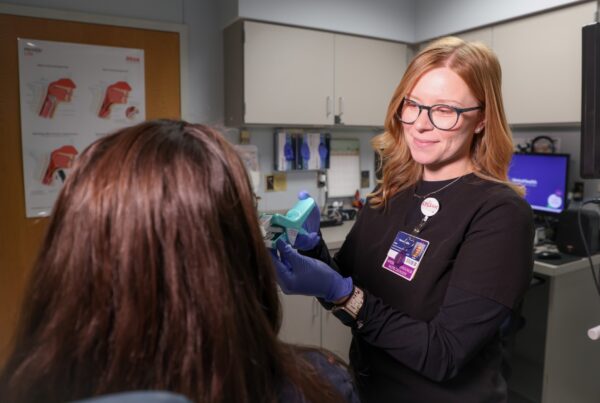 Burn therapist helps facial burn survivor.