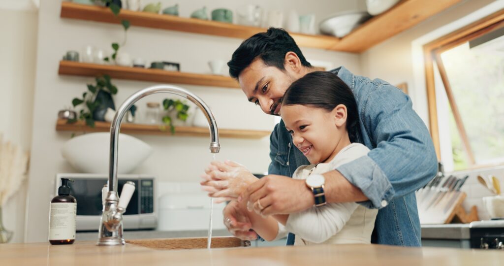 Father and child washing hands