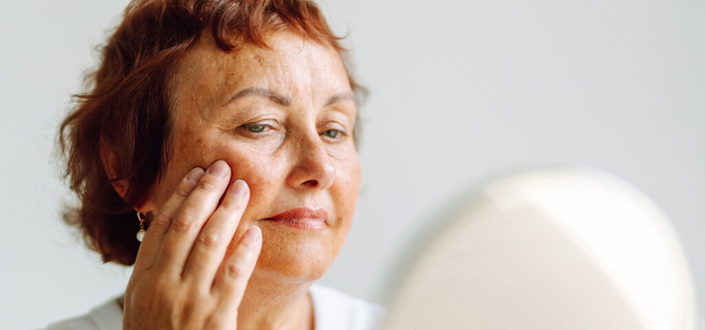 Woman thinking about plastic surgery