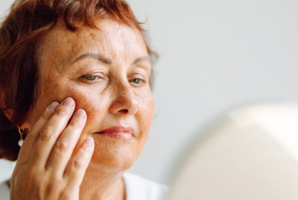 Woman thinking about plastic surgery