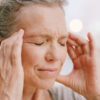 stroke signs - woman with headache