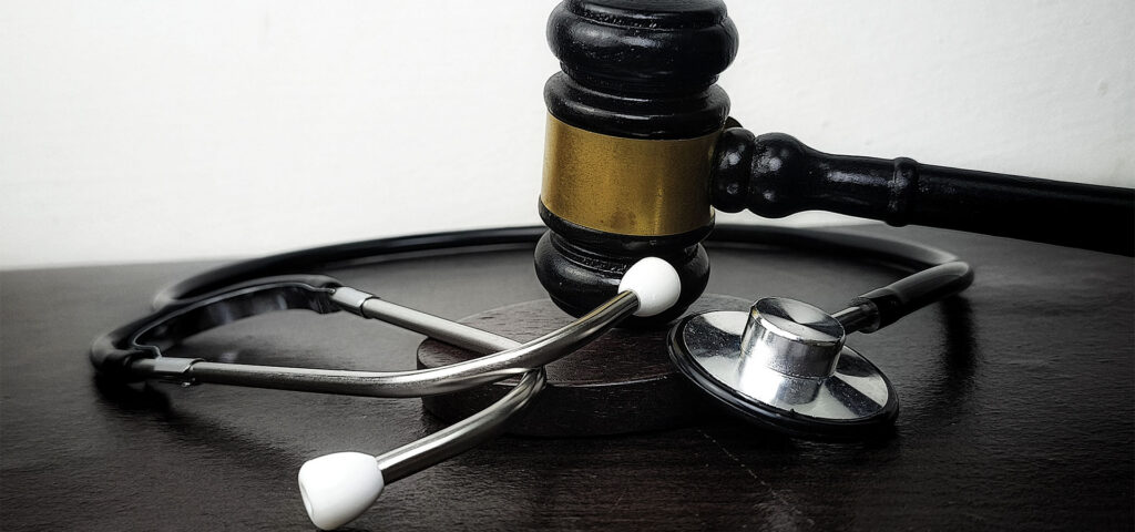 gavel and stethoscope representing clinical ethics
